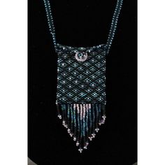 Artisan Jewelry Beaded WICCA Amulet Bag Aqua Blue Pattern Necklace Liz Schwartz. Hand crafted one of a kind piece. 26" long strap.  The pouch is 2.5" by 2" and the fringe is 2" long. Woven seed glass beads. Long flap in the front.  Be an original. Great for a water witch. Rectangular Beaded Necklace With Large Beads For Gifts, Blue Beaded Jewelry For Everyday Use, Bohemian Rectangular Necklaces For Everyday Use, Bohemian Rectangular Necklace For Everyday Use, Everyday Blue Beaded Jewelry, Bohemian Rectangular Necklace, Everyday Rectangular Bohemian Necklace, Handmade Beaded Necklaces With Round Beads For Everyday, Blue Round Beads Jewelry For Everyday