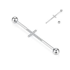 a pair of earrings with cross and balls on the end, one is white gold