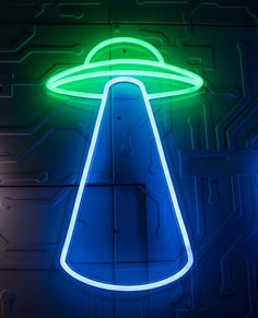 a neon sign with an alien hat on it