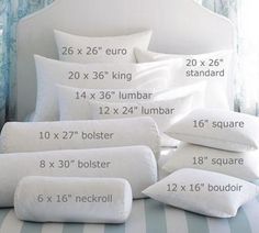 the measurements of pillows and pillow cases on a bed with blue striped sheets in front of them