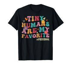 a black t - shirt with the words tiny humans are my favorite in colorful letters