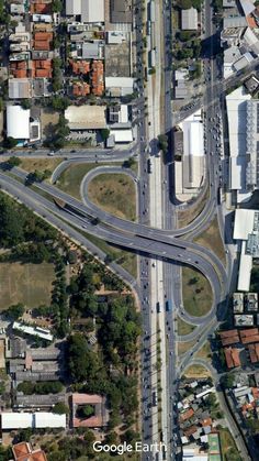 an aerial view of a street intersection in the city