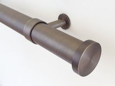 an image of a metal curtain rod on the wall