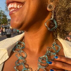 What happens when you cross an empty mini bar gin bottle with our wavy glass studio technique? Magic baby blue ruffle glass! These beautiful earrings are both stunning and light and easy to wear. Finished with sterling boomerang ear wires. Glass is approximately 1 inch by 1 inch. Earring length (drop) is approximately 2 inches. Patented.  Aqua from a Bombay Sapphire Gin bottle Recycled glass and sterling silver Bombay Sapphire Gin, Stocking Fillers For Him, Bombay Sapphire, Gin Bottle, Smart Glass, Sustainable Accessories, Stocking Fillers For Her, Glass Studio, Forever Jewelry