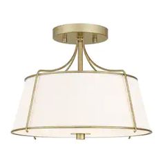 a light fixture with a white shade on the bottom and a gold frame around it