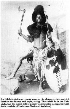 an old photo of a man in native clothing holding a spear and shield with the caption