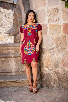 This Beautiful Floral embroidered Dress is the perfect dress to add to your wardrobe. -Its cute enough to dress up for a party or even just wear it to a picnic. -It's lightweight, handmade and hand embroidered by Mexican Artisans in Puebla, Mexico. Fitted Cotton Dress With Embroidered Neckline, Multicolor Floral Embroidered Knee-length Dress, Short Sleeve Cotton Dress With Geometric Embroidery, Knee-length Multicolor Floral Embroidery Dress, Cotton Dresses With Geometric Embroidery And Short Sleeves, Multicolor Floral Embroidery Knee-length Dress, Multicolor Embroidered Dress With Embroidered Sleeves, Red Floral Embroidered Cotton Dress, Embroidered Cotton Mini Dresses