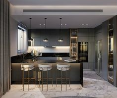 a modern kitchen with marble counter tops and bar stools