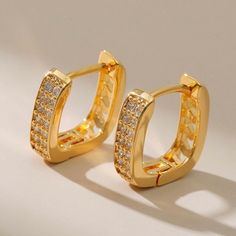 Details: Gold-tone. 18kt gold-plated brass. Medium hoop design. Hinge-pin fastening. With cubic zirconia stones. These earrings come as a pair. Gold Plated Diamond Accented Huggie Hoop Earrings, Gold Hoop Diamond Earrings With Accents, Gold Hoop Diamond Earrings Tarnish Resistant, Gold Cubic Zirconia Huggie Hoop Earrings, Gold Cubic Zirconia Hoop Earrings, Ring Party Jewelry, Gold Earrings Models, Hoop Earrings Style, Jewelry Earrings Hoops