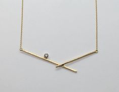 Diamond & Gold Necklace - Handmade 14k yellow gold pendant with unique bar design is punctuated with a round, modern, brilliant cut diamond (0.1ctw, SI/G).  Contemporary and elegant, this makes the perfect accent to any outfit.<br><br>Finished with a lobster clasp closure. Yellow Gold Bar Necklace With Single Cut Diamonds, Modern 14k Yellow Gold Bar Necklace, Minimalist Yellow Gold Bar Necklace With Diamond Accents, Gold Minimalist Diamond Bar Necklace, Minimalist Gold Diamond Bar Necklace, Modern 14k Gold Diamond Necklace For Formal Occasions, Modern Formal Diamond Necklace With Single Diamond, Modern Single Diamond Necklace For Formal Occasions, Modern Gold Diamond Necklace With Single Diamond