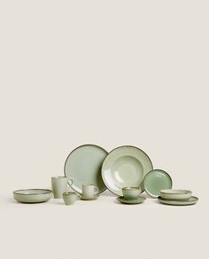 a group of green dishes and cups