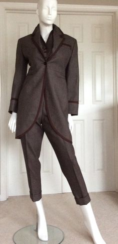 "Wonderful unworn three piece pantsuit from my private museum quality Romeo Gigli collection. This three piece set is great for casual business attire as well a# elegant evening attire. Romeo Gigli would have mixed the vest with other silk pieces in his collection. The pant would have been shown with his signature silk iridescent blouses. (I have put one of his silk blouses under the vest. Blouses are in separate listings) The pants pockets have excellent workmanship with bound closure and worki Fitted Brown Three-piece Suit For Office, Elegant Brown Three-piece Suit For Winter, Elegant Brown Three-piece Winter Suit, Fitted Winter Formal Pantsuit, Winter Formal Fitted Pantsuit, Brown Fitted Three-piece Suit For Winter, Brown Three-piece Suit For Fall Formal Occasions, Fitted Brown Formal Pantsuit, Fitted Brown Three-piece Suit For Fall