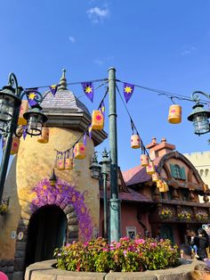 the entrance to disneyland's fairy land is decorated with flowers and lanterns for decoration