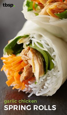 a wrap filled with chicken and veggies on top of rice