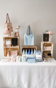 a table topped with lots of different types of bags and boxes on top of it