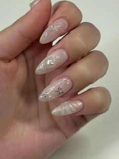 a woman's hand with some white and pink nails