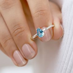 A classic cut, the pear-shaped Armand ring Swiss blue topaz is the ultimate ring to gift a loved one. It is a timeless piece that can always be paired with other nesting bands to elevate your look. A ring that will never disappoint, and makes the promise ring for a friend. Details: Center stone Gemstone: Swiss Blue Topaz Stone Shape: Pear Measurements: 7x5 mm Band measurements: approx. 1.8mm wide, approx. 1.5mm thick Gold vermeil is not the same as gold plated, it is basically a thicker layer of Pear-shaped Topaz Promise Ring, Fine Jewelry Pear-shaped Topaz Ring, Fine Jewelry Blue Topaz Teardrop Rings, Fine Jewelry Pear-shaped Topaz Ring For Anniversary, Pear-shaped Topaz Ring For Anniversary, Fine Jewelry, Teardrop Topaz Ring With Accent Stones For Anniversary, Pear-shaped Topaz Promise Ring With Accent Stones, Pear-shaped Topaz Ring For Anniversary, Anniversary Blue Topaz Teardrop Ring