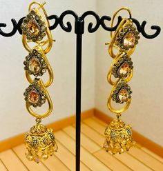 Beautiful bollywood indian pakistani gold pleated earring  Please keep in mind that the colour of the product shown in the pictures may vary from the original due to the lighting used. Gold Hoop Earrings With Intricate Design For Party, Elegant Stone Work Danglers For Diwali, Elegant Danglers For Festive Reception, Elegant Danglers For Reception And Festive Occasions, Elegant Danglers With Stone Work For Reception, Elegant Metal Chandbali Bridal Earrings, Elegant Chandbali Bridal Earrings In Metal, Elegant Metal Jhumkas With Intricate Design, Elegant Metal Chandbalis With Intricate Design