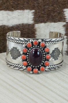 "This spiny oyster and sterling silver bracelet was made by Navajo silversmith Sandra Parkett. The back is signed S. Parkett and Sterling. Size: 5 1/4\" (will fit a 6 1/2\" wrist) Gap: 1 1/4\" Length: 1 1/2\" Free shipping on all orders! We ship with USPS and always include tracking. All orders ship within a day of payment. Returns are accepted up to 30 days after you receive your order. Just send us a message. Our shop offers cash back or store credit. The item must be returned in new condition Navajo Bracelet, Spiny Oyster, Sterling Silver Bracelet, Native American Jewelry, Free Jewelry, Sterling Silver Bracelets, Cuff Bracelets, Silver Bracelet, Jewelry Watches