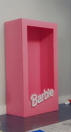 a pink box with the word barbie on it