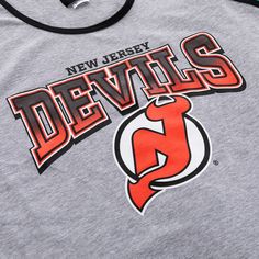 The Originals Collection Be prepared for anything this summer in this Devils Gradient Print Tank Top! This NHL Licensed tank top is perfect for any task you may have going on that day. Made from 100% cotton, this comfortable tank top comes with your favorite team's logo screen printed onto the shirt! Officially Licensed NHL Product comes with Authentic Hangtags Devils font features a gradient effect 100% Cotton Sleeveless Team Spirit Tops For Streetwear, Crew Neck Cotton Tank Top For Sports, Sporty Cotton Tank Top For Leisure, Casual Cotton Tank Top For Leisure, Casual Cotton Racerback T-shirt, Summer Cotton T-shirt With Team Spirit Style, Cotton Muscle Tee With Letter Print, Cotton Team Spirit Tank Top, Team Spirit Cotton Tank Top For Sports