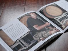 an open magazine with a man sitting on a barrel