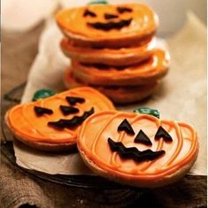 some cookies are decorated to look like jack - o'- lanterns