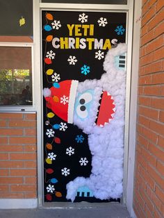 a door decorated to look like a santa clause with the words yeti christmas written on it