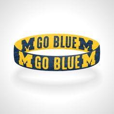 This Is A Lightweight And Durable Wristband Made From Polyester Elastic. Great For Tailgating And Watching The Game! The Wristbands Are 3/4 Inches Tall. Reversible - One Side Is Blue With Yellow Letters And The Reverse Side Is Yellow With Blue Letters. Flip It To Go With Any Michigan Gear. Made In Multiple Sizes So Pick The Size That Fits You The Best. These Are Unisex - Made For Both Men And Women. Closed With A Black Ribbon. The Elastic Does Contain Latex. Handmade In The Usa. Adjustable Blue Sports Wristband, Adjustable Blue Wristband For Sports, Blue Adjustable Bracelets For Team Spirit, Yellow Letters, Blue Letters, Go Blue, Michigan Wolverines, Black Ribbon, Wristbands