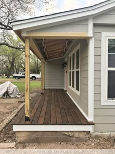 a house with a covered porch in the front yard