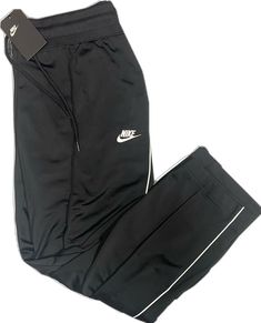 Nike Athleisure Sweatpants For Gym, Black Athleisure Gym Bottoms, Nike Moisture-wicking Sweatpants For Gym, Nike Sportswear Sweatpants For Jogging, Nike Sportswear Joggers For Gym, Nike Sports Pants For Sports Season, Nike Stretch Athleisure Sweatpants, Nike Stretch Casual Sweatpants, Black Athleisure Bottoms