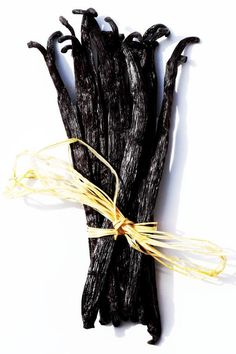 some black sticks with yellow string tied to them