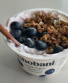 yogurt with granola and blueberries in a bowl