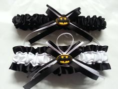 three pieces of black and white garter with batman symbols