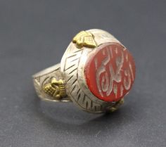 Afghan Turkmen traditional silver mughal hand made ring. Its %100 hand crafted workmanship with beautiful Arabic scripture Intaglio and Carnelian stones. Please do not hesitate to contact if you have any questions about items or further information. Measures :  . Size of the ring : 9 US Jewelry Ring Mandrel, Weight : 8.3 Grams, Shipping & Estimated Delivery Time With Turkish Registered Post, Destination CountryStandard Shipping (business days) United States          15-20  Europe7-15 Asia15-25 Traditional Carved Rings For Ceremonial Occasions, Traditional Carved Ceremonial Rings, Traditional Etched Ceremonial Rings, Traditional Etched Rings For Ceremonial Occasions, Traditional Adjustable Engraved Ring For Ceremonial Occasions, Traditional Adjustable Engraved Ring For Ceremonies, Adjustable Traditional Engraved Ring For Ceremonial Occasions, Traditional Sterling Silver Engraved Ring For Ceremonial Occasions, Traditional Silver Signet Ring For Ceremonial Use