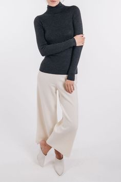 Our classic long sleeve turtleneck is perfect for layering or wearing on it's own. TCVRT00 - 100% superfine cashmere- Rib stitch detail- Fitted- Hits at hip- Model is 5'9" and wearing a size Small Chic Cashmere Turtleneck For Fall, Cashmere Long Sleeve Turtleneck For Fall, Long Sleeve Cashmere Turtleneck For Fall, Cashmere Long Sleeve Turtleneck For Layering, Elegant Stretch Cashmere Sweater, Elegant Fine Knit Turtleneck For Layering, Chic Cashmere Turtleneck, Elegant Stretch Fine Knit Turtleneck, Chic Long Sleeve Merino Wool Turtleneck