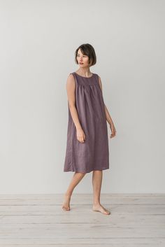 "NINA gather dress made from soft linen in lavender. - length is ± 107 cm (42\") (depends on size) - gathered front and back - loose fit - without pockets DETAILS: - 100 % European, pre-washed medium weight linen (205 g/m²) - the model is 176 cm (5′9″) high, wearing size S. - model measurements: bust 83 cm (33\") / waist 61 cm (24\") / hips 90 cm (36\") - color in the picture - lavender (you can choose other color on the right) MADE TO ORDER: All pieces are made to order, it will take up to 10 w Lavender Sleeveless Sundress, Summer Knee-length Sleep Dress, Lavender Sleeveless Dress For Daywear, Lavender Sleeveless Day Dress, Lavender Dresses For Daywear, Gather Dress, Linen Gown, Linen Sleepwear, Midi Dress Vintage