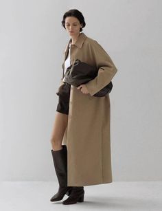 Easy chic long tan twill coat 55% cotton , 41% polyester, 4% spandex 100% polyester lining Fit is oversized Side pockets Button sleeve cuffBust 55"/145 cmTotal length 53"/135 cmModel wears one size and is 5.8"/170 cm Imported Long Coat With Skirt, Coat With Skirt, Fits Inspiration, Twill Coat, Pixie Market, Easy Chic, Maxi Coat, Midi Maxi Dress, Short Jumpsuit