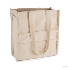 a canvas tote bag on a white background with the handles down and one side open