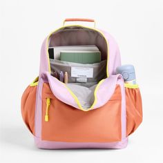 A backpack that's extra comfy and ready to handle all the adventures of the day. Combining colorblocks of purple and orange with pops of yellow trim, the kids' large knapsack is constructed of supremely durable polyester fabric that includes recycled plastic bottles. A roomy interior holds everything your kid needs-books, school supplies, extra layers-and there's a padded pocket to keep their tablet protected. Outside pockets hold snacks, water bottles and more. Pair this book bag with the match Playful Nylon Bags For Back To School, Playful Nylon School Bag, Sporty Multicolor Student Backpack, Playful Pink Backpack For Outdoor Activities, Functional Orange Backpack For School, Multicolor Backpack For Outdoor Back To School, Multicolor Backpack For Back To School And Outdoor, Rectangular Orange Backpack For School, Playful Purple Backpack For Everyday Use