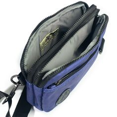 A lovely purple/blue shade with a silvery gray liner. Versatile, fun and cute this lightweight bag features 3 functions in 1. Wear it as a hip pack, crossbody bag or wristlet. Stay hands free and carefree with plenty of room for your wallet, keys, phone and other small everyday necessities. Our strap system is intended to create versatility of use and fit a variety of body types. Includes:-4 zippered compartments -52” strap that fits waist/hip size 39”-61.5” or extend fully for crossbody wear -3 Functional Bags With Zipper Closure And Adjustable Fit, Blue Travel Shoulder Bag With Zipper Pouch, Adjustable Everyday Bag With Zipper Pouch, Functional Adjustable Crossbody Bag, Everyday Bags With Adjustable Zipper Pouch, Casual Purple Shoulder Bag For Outdoor, Blue Adjustable Shoulder Bag For Everyday Use, Blue Shoulder Bag Pouch For Everyday Use, Adjustable Shoulder Bag With Removable Pouch For Travel