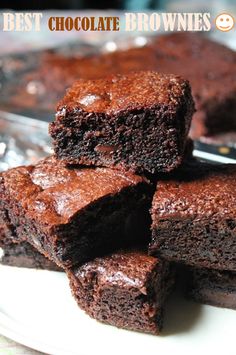 chocolate brownies stacked on top of each other in front of a glass plate with the words best chocolate brownies