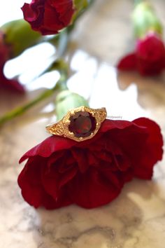 Metal: 14kt Yellow Gold Stone: Garnet Shape: Round Garnet Weight: 1.65 ctw Ring Size: 5 1/2 Sizing: Please state ring size in the personalization box. Weight of entire piece with stones: 3.50grams Width Of Top Part Of Ring : 10mm Customization: We can custom make this ring with any gems and metals. Please inquire if interested. White Gold Amethyst Version: https://www.etsy.com/listing/231479258/sale-vintage-style-14k-white-gold?ref=shop_home_active_7&frs=1 Rose Gold Aquamarine Version: https Elegant Yellow Gold Ruby Ring With Intricate Design, Yellow Gold Ruby Ring With Filigree For Anniversary, Elegant 14k Gold Ruby Ring With Intricate Design, Ornate Yellow Gold Ruby Ring With Intricate Design, Ornate 14k Gold Ruby Ring For Anniversary, Elegant Ruby Ring With Filigree For Promise, Gold Filigree Ruby Ring For Anniversary, Gold Ruby Ring With Filigree For Anniversary, Gold Filigree Ring With Accent Stones For Anniversary