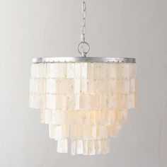 Rectangular shell tiles hanging in tiers offer an updated take on classic vakker. Our pendant showcases the shells to stunning effect, casting an ambient, pearlescent glow. 
 The light-catching iridescence of our exclusive Capiz Chandelier will draw attention even when the lights are off. 3 tiers of more than Capiz shells cascade from an iron frame, emitting a warm glow of diffused light. 
 If you have any questions about our products, please contact us and we will get back to you within 24 hour Capiz Chandelier, Shell Tiles, Shell Chandelier, Rh Teen, Capiz Shell, Hanging Chandelier, Naha, Vintage Chandelier, Estilo Art Deco