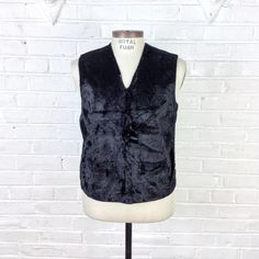 Size M - L Vintage 1950s Black Faux Fur Front Pullover Vest with Knit Back For your consideration we have a vintage vest from the 1950s. Done in a black faux fur front with knit wool back, this vest features a V neck and 2 hip pockets, There are some issues including a hole at the neck that needs to be repaired. With a little TLC, this will be a wonderful vest for anyone into Mid-century Menswear.Measurements;Chest- 20 1/2”Waist- 20 1/2”Length- 20” (taken down the back)Weight- 10ozMeasurements t Vintage Sweater Vest For Fall Workwear, Vintage Black Vest Outerwear, Retro Black Winter Vest, Vintage Black Winter Vest, Vintage Black Vest For Fall, Black Vintage Vest For Fall, Pullover Vest, Vintage Vest, Mens Vests