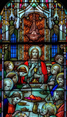 a stained glass window with an image of jesus and other people sitting at a table