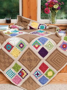 the cover of an article with crocheted granny's quilts on it