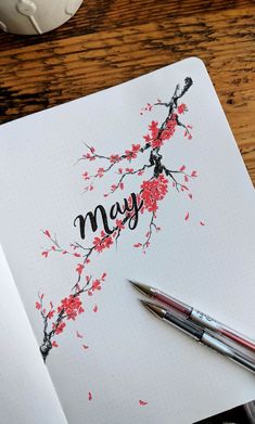 a notebook with the word may written on it