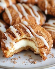 a white plate topped with donuts covered in icing