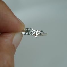 Hope ring is made from 925 Sterling silver. Wear it alone or stack it with other words and symbols This ring is handmade and hand cast, each one is a little bit one of a kind and will never be 100% exact. Gift box included. For more information please read our policies. Thank you so much visiting and hope you enjoy shopping with us!! Pitchanan Hope Ring, Word Rings, Movement Jewelry, Word Ring, Awareness Jewelry, Raw Crystal Ring, Elephant Ring, Fish Jewelry, Elephant Jewelry